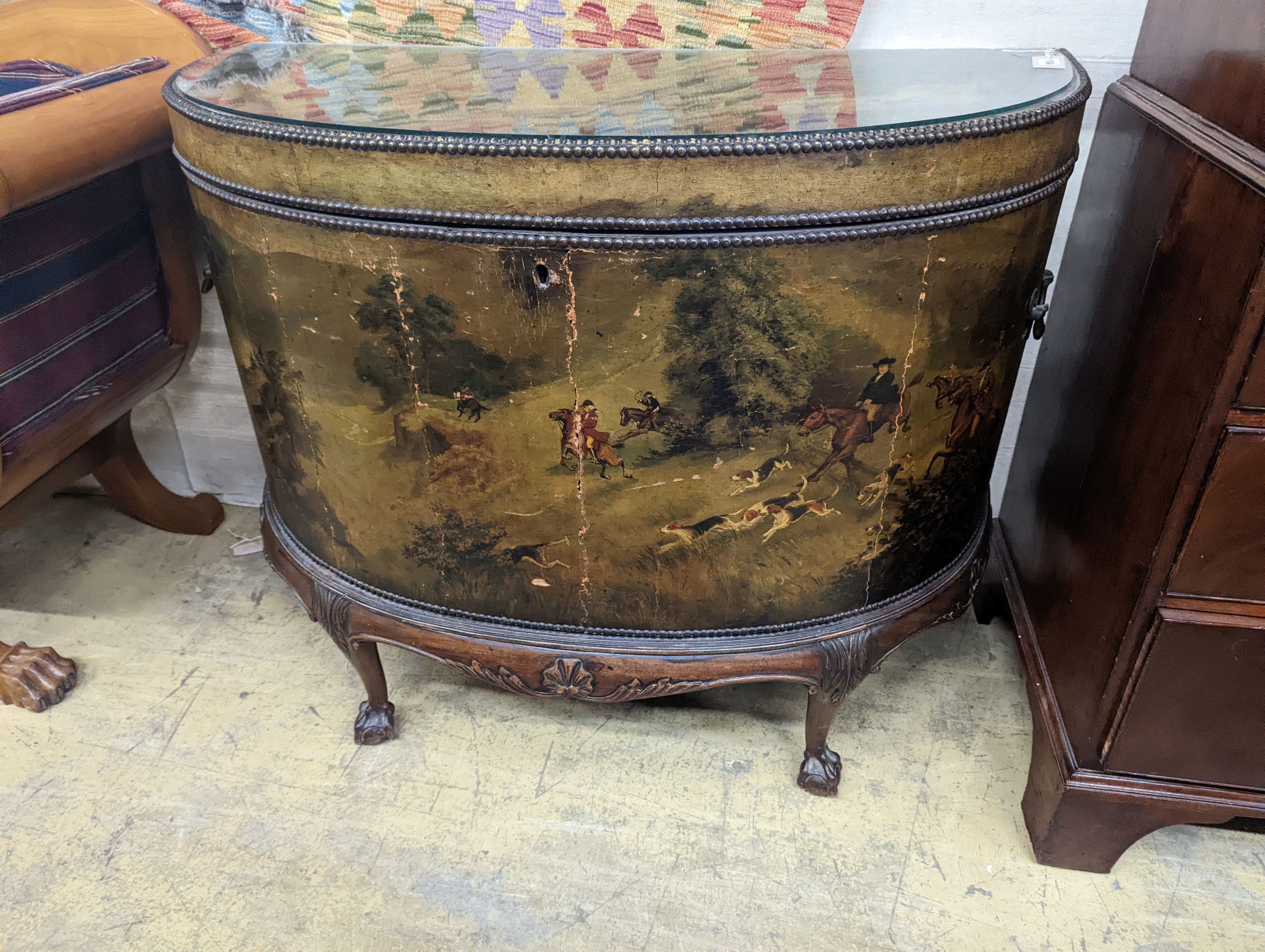 An early 20th century leather covered mahogany D shaped hinged top coffer painted with hunting scenes, length 114cm, depth 53cm, height 91cm